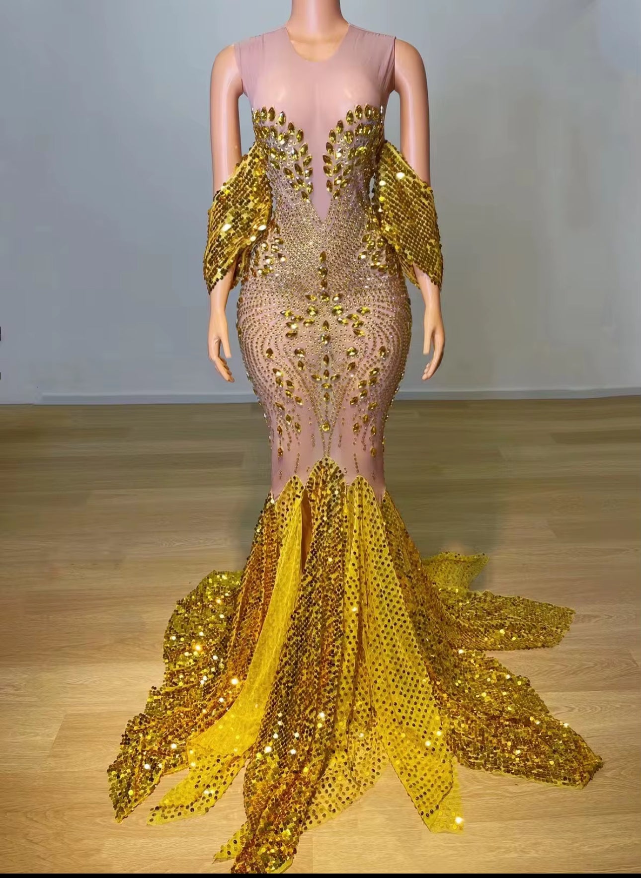 Unleash bold glamour in our Golden Siren Couture Gown — a striking masterpiece designed for unforgettable entrances. Featuring intricate crystal embellishments, dramatic gold detailing, and a sculpted mermaid silhouette, this gown is crafted for women who command attention.

✨ Hand-embellished crystal detailing
✨ Sculpted mermaid silhouette
✨ Dramatic gold accent panels
✨ Perfect for pageants, red carpet events, luxury birthdays & galas
✨ Designed to shine under every spotlight

Where Elegance Meets Luxury.